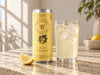 Foreva Farmers Meadow Lemonade Soda 250ml can beside an iced drink on a sunlit stone table