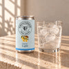 Foreva Farmers Classic Light Tonic 150ml can with an iced drink on a sunlit stone table