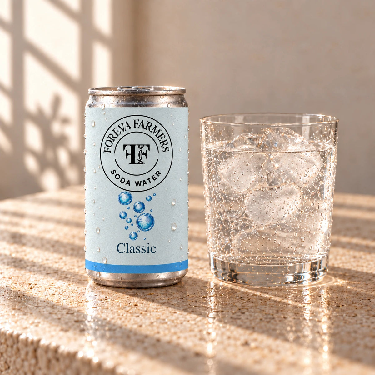 Foreva Farmers Classic Soda Water 150ml can with an iced drink on a sunlit stone table