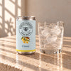 Foreva Farmers Classic Tonic 150ml can with an iced drink on a sunlit stone table