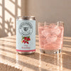 Foreva Farmers Pink Rosehip Lemonade 150ml can with an iced drink on a sunlit stone table