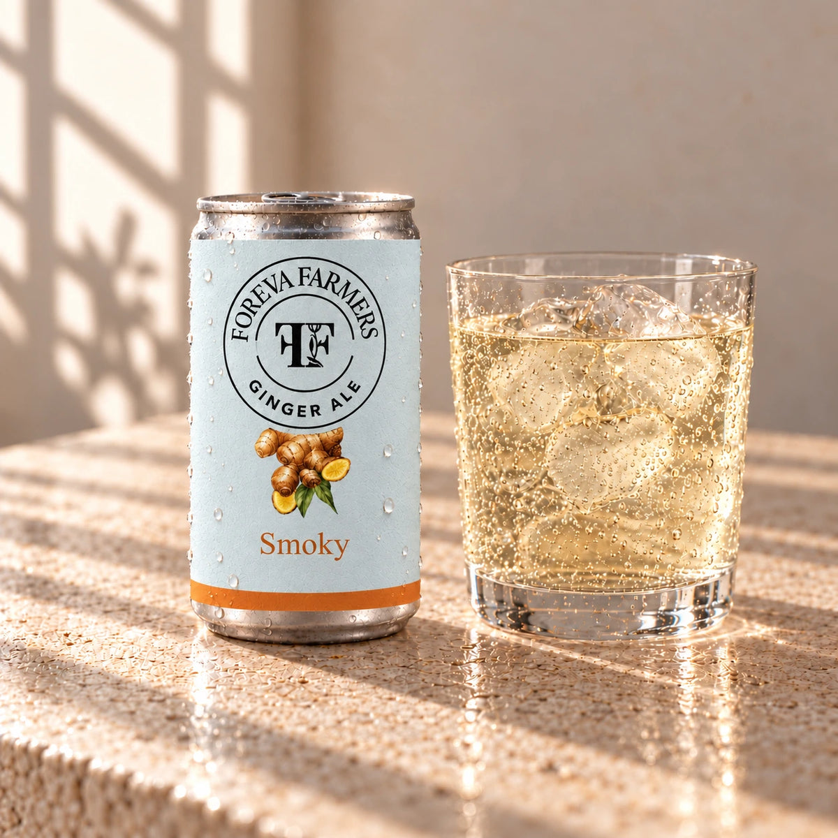 Foreva Farmers Smoky Ginger Ale 150ml can with an iced drink on a sunlit stone table