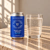 Foreva Farmers Sparkling Spring Water 330ml can beside a glass of sparkling water
