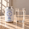 Foreva Farmers Still Spring Water in a standard 330ml can beside a glass of still water