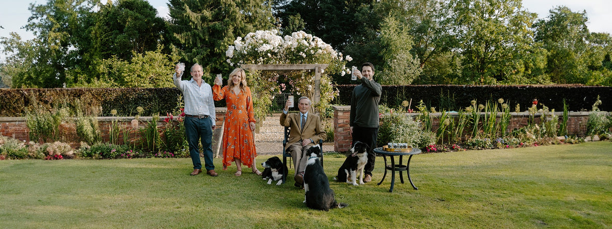 The Foreva Farmers family raising a glass in the garden on the farm